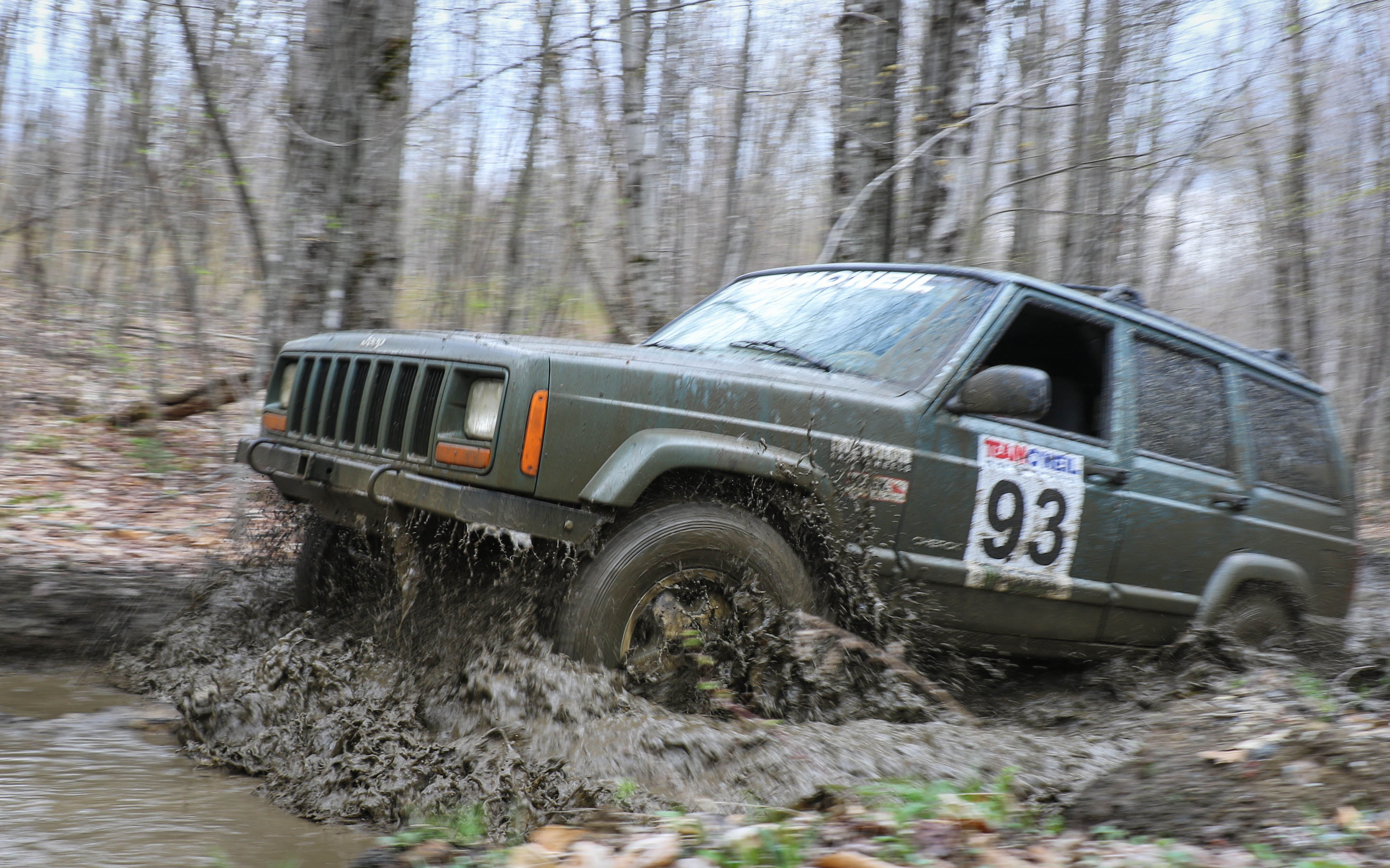 Jeep Cherokee driving in deep mud in the woods of Northern New Hampshire 
