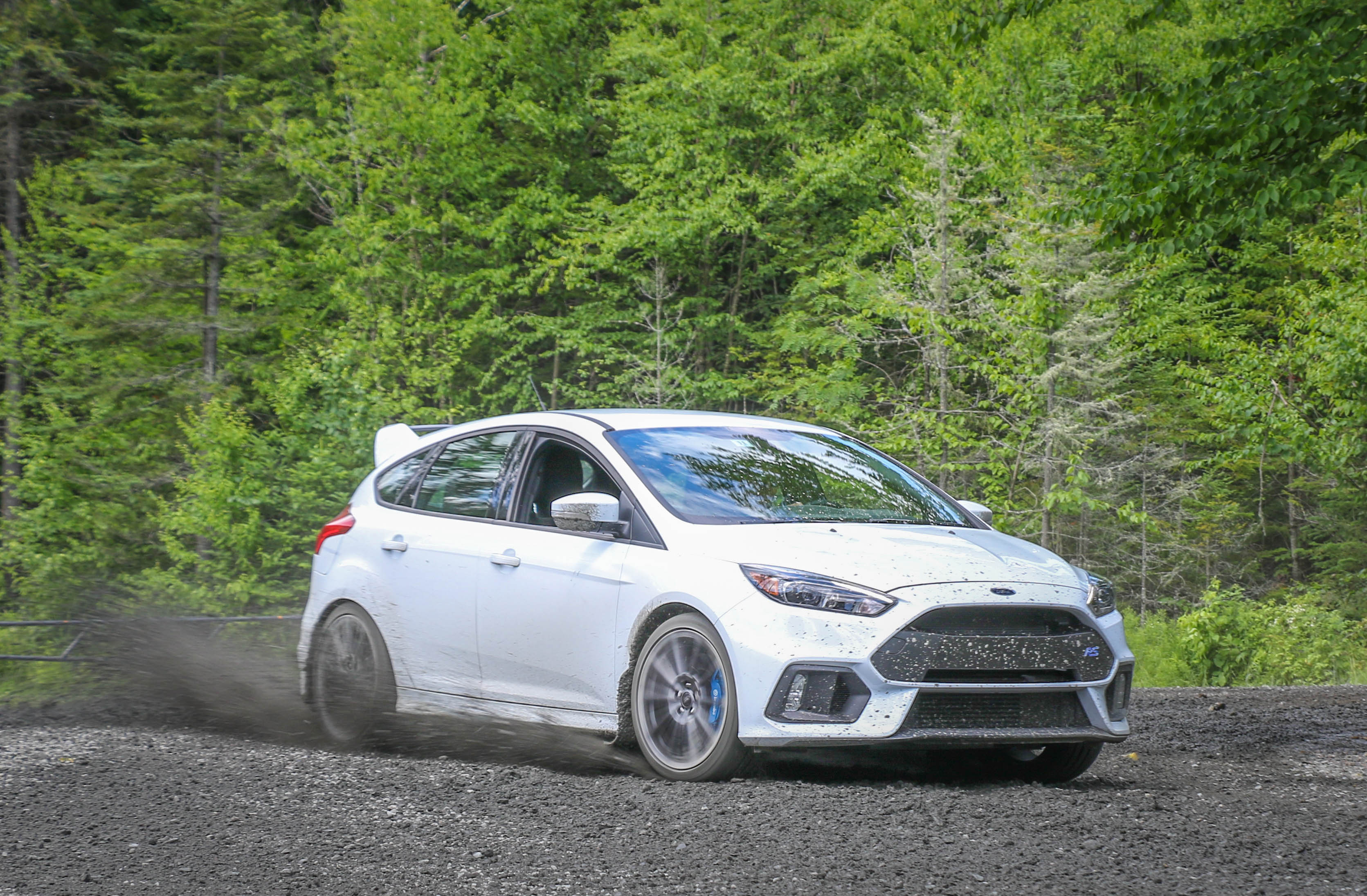 Ford Focus with manual transmission driving on a dirt road
