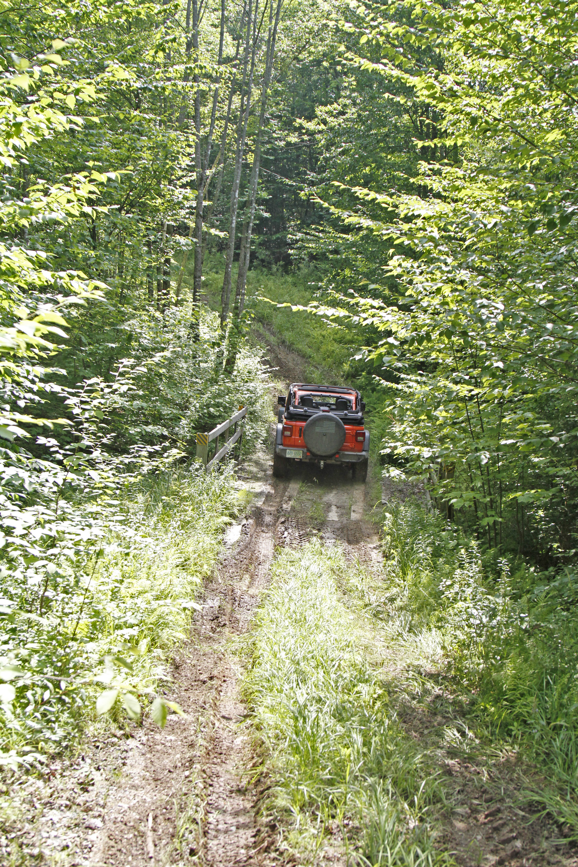 Jeep Rubicon off-roading in the woods of northern New Hampshire